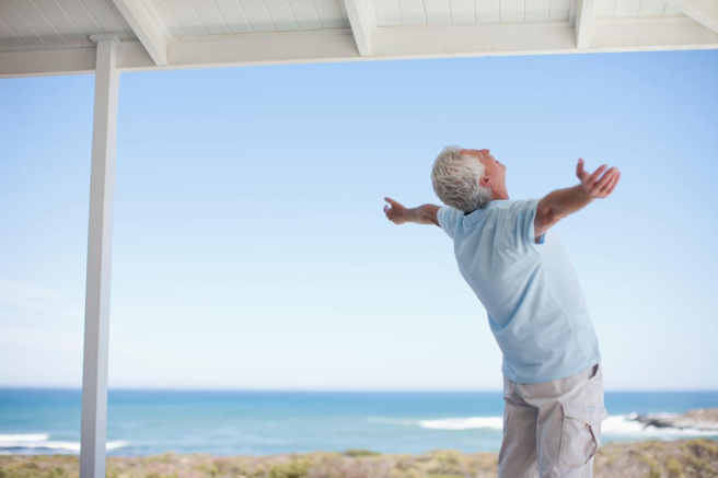Happy Senior Man By Beach