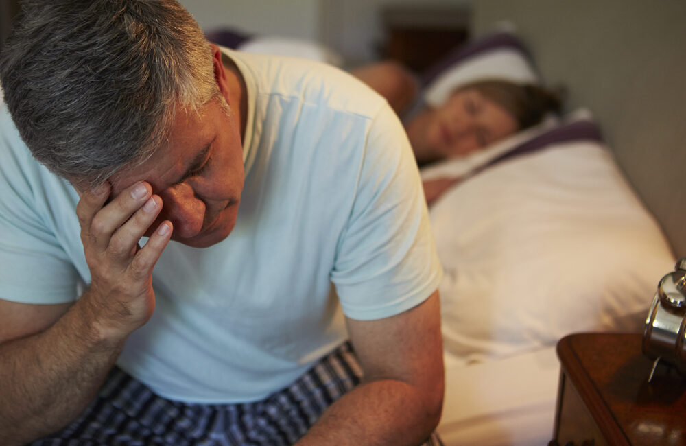 Man awake in bed